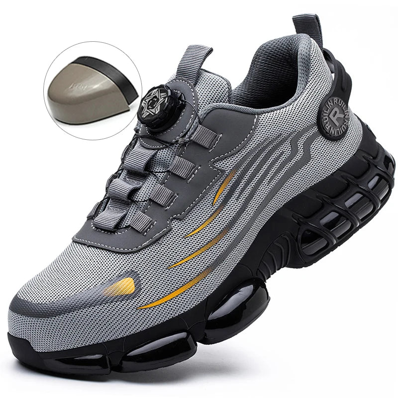 Gray athletic shoe with black sole and yellow accents on a white background