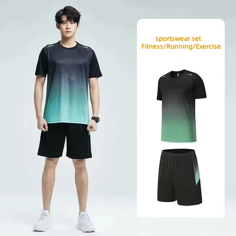 Person wearing a gradient black to green sports outfit with shorts, standing against a light gray background.