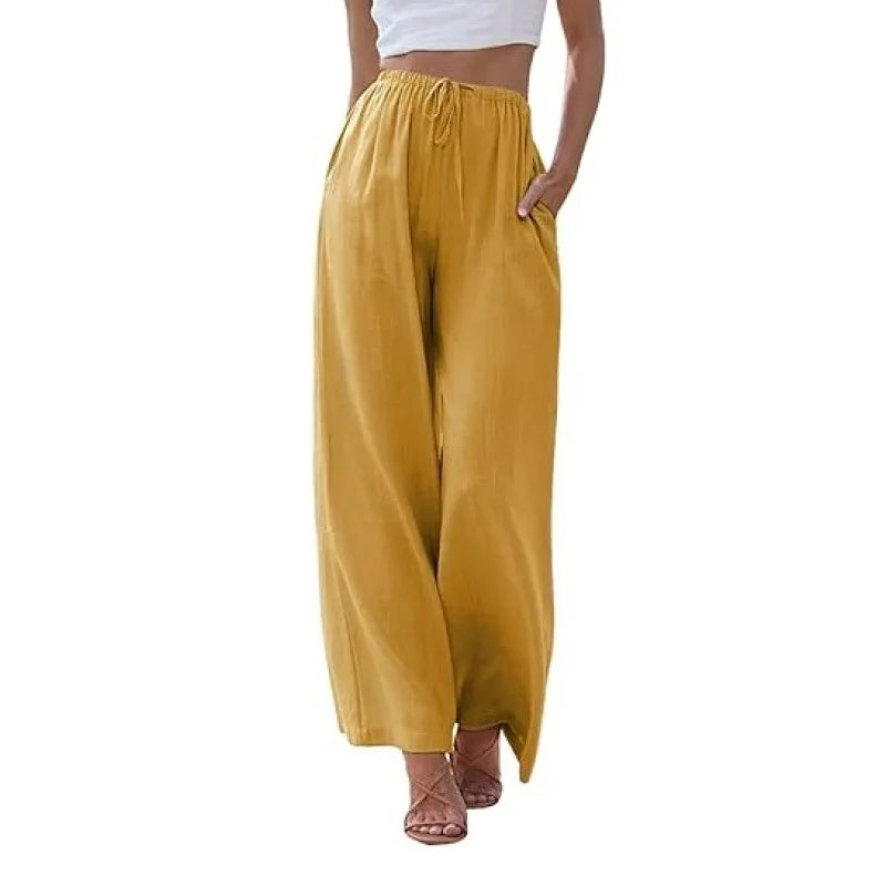 Mustard yellow wide-leg pants worn by a person on a white background