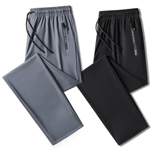 Gray and black pants with drawstrings on a white background