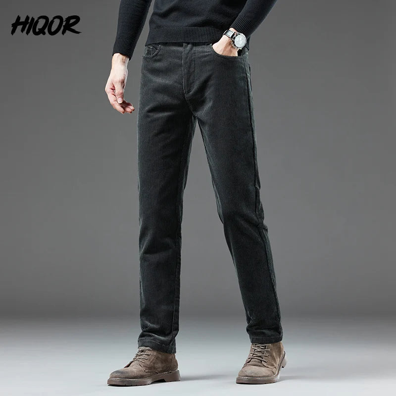 Person wearing dark gray pants with a plain background and 'HIQOR' branding.