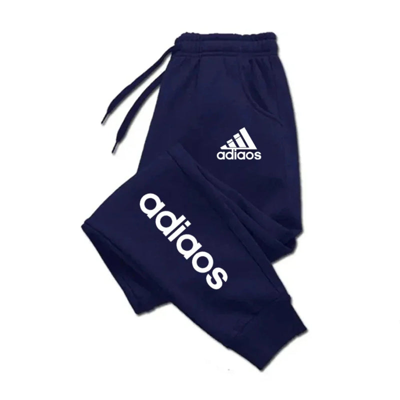 Navy blue Adidas tracksuit on a white background