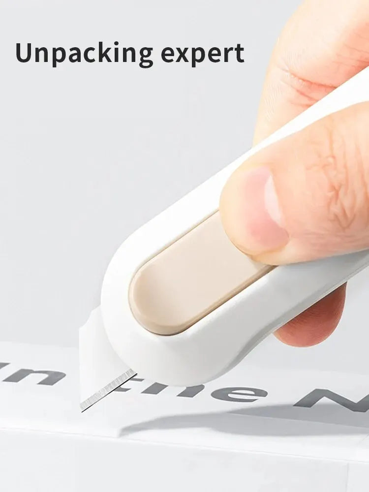 Compact mini box opener and paper cutting knife in a portable design for unboxing, stationery, and wallpaper cutting tasks white