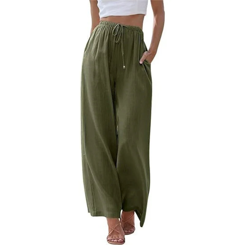 Green wide-leg pants worn by a person on a white background