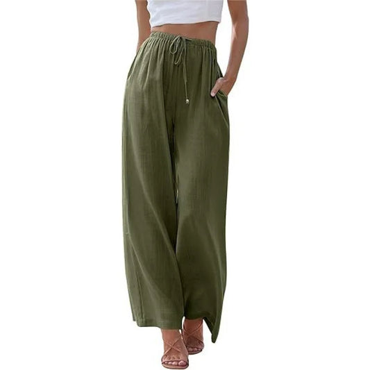 Green wide-leg pants worn by a person on a white background