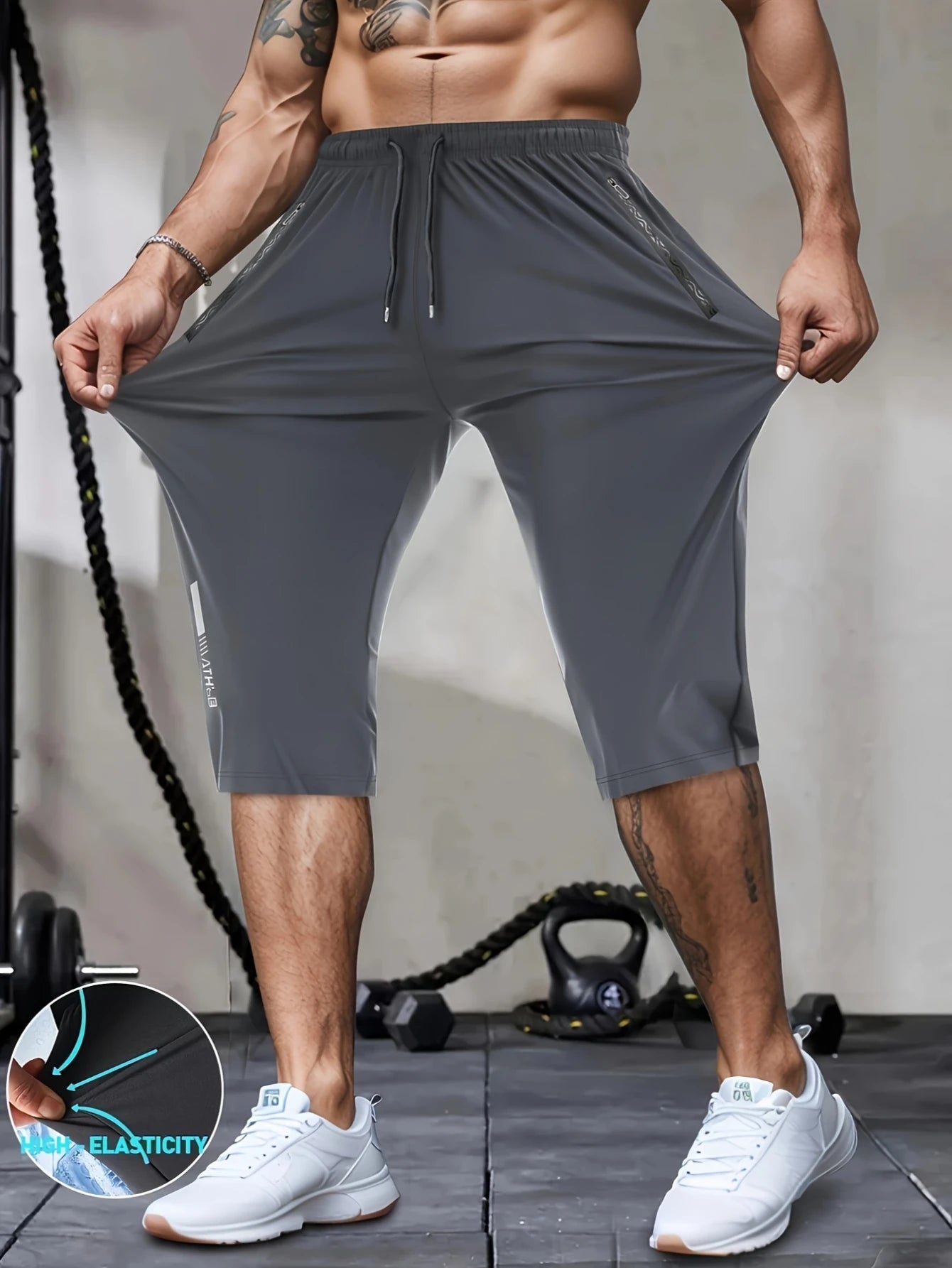 Person wearing gray athletic shorts with a fitness background