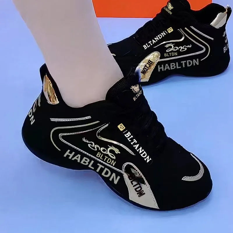 Black high-top sneakers with branding on a blue background