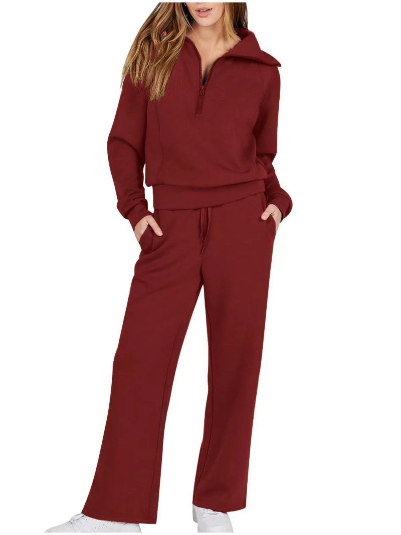 Maroon tracksuit worn by a person on a white background