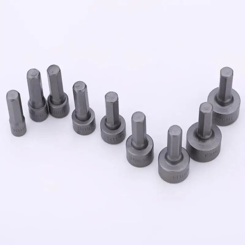 Set of gray metal cylindrical components on a white background