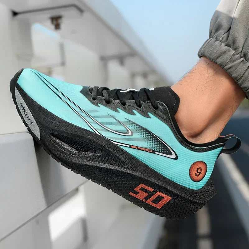 Turquoise and black running shoe with red text on a blurred indoor background