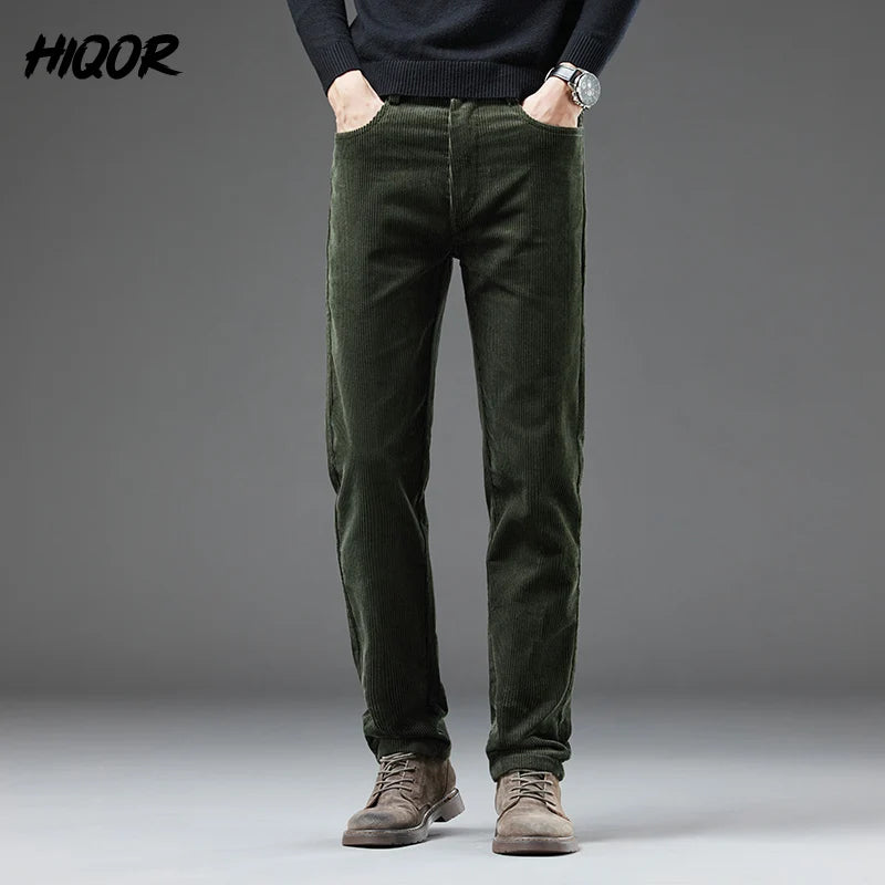 Person wearing green corduroy pants with a gray background and 'HIGOR' branding.